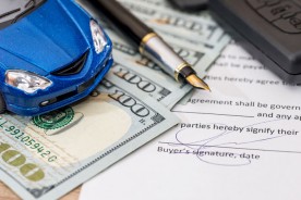 blue car with auto loan document